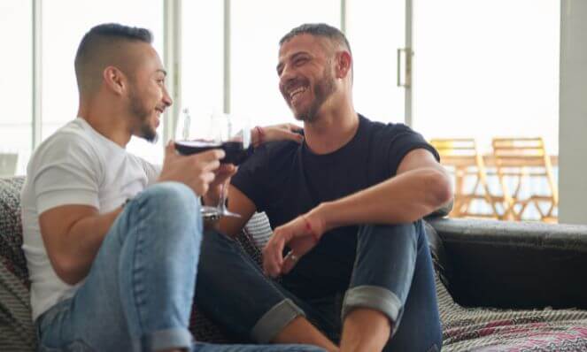 An image of a gay couple communicating affectionately.