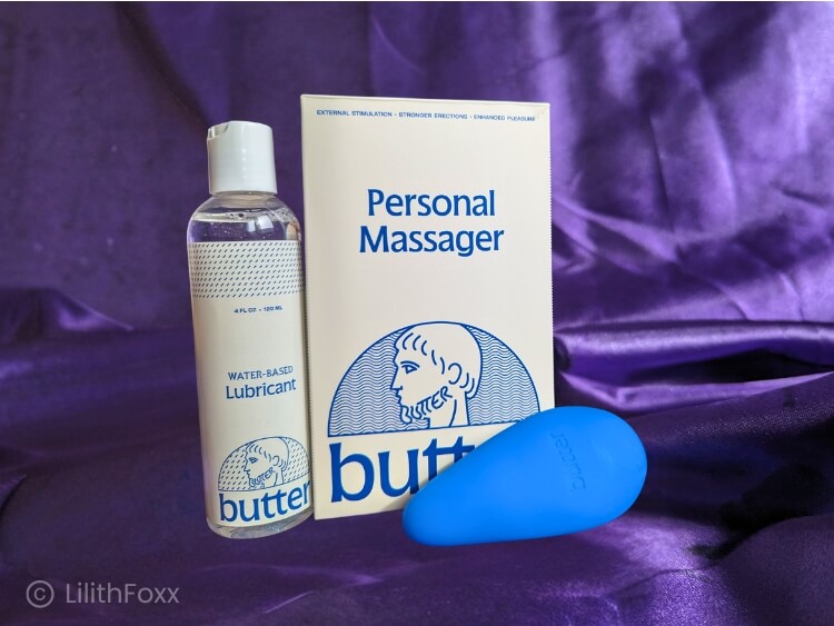 An image of Butter Wellness The Personal Massager men's vibrator and a bottle of their water-based lubricant.
