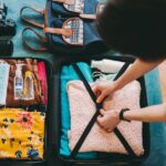 A woman packing a BDSM aftercare kit.