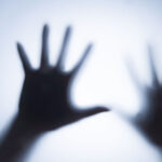 Ghostly hands on a bright lit background of fear play.