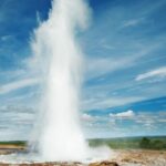 A jet of water squirting out of a geyser.
