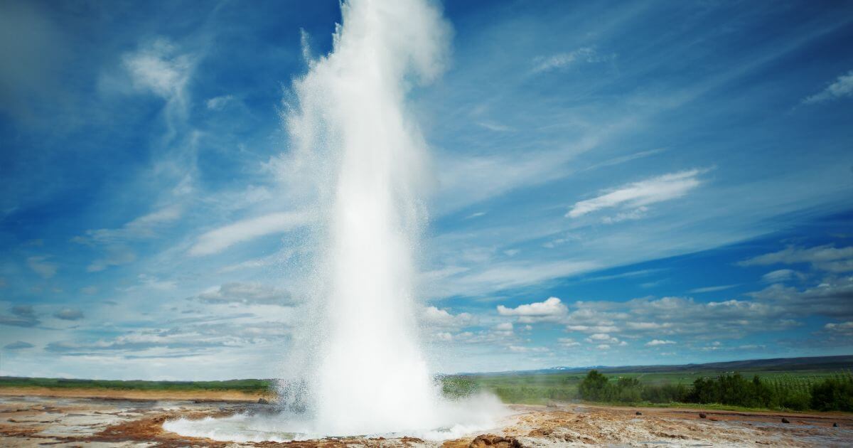 A jet of water squirting out of a geyser.
